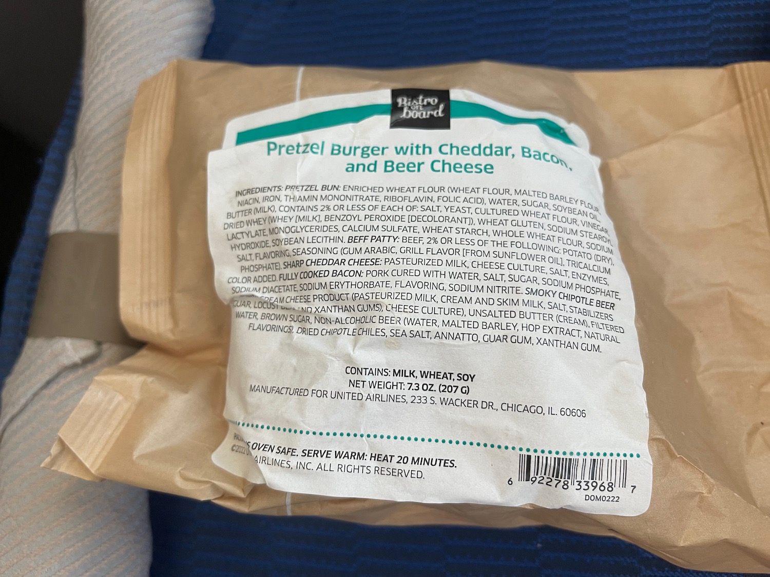 a package of cheese on a blue and white blanket