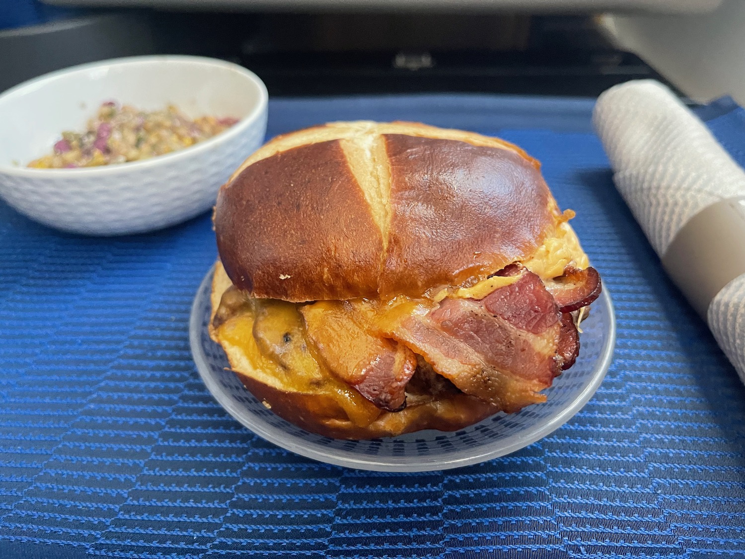 a bacon sandwich on a plate