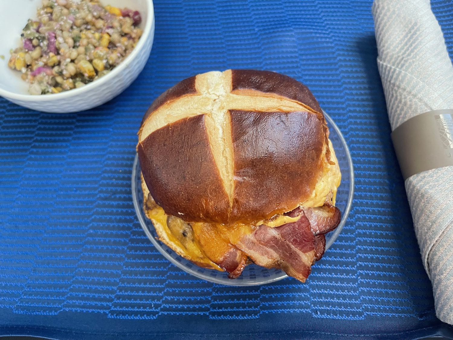 a bacon and egg sandwich on a plate
