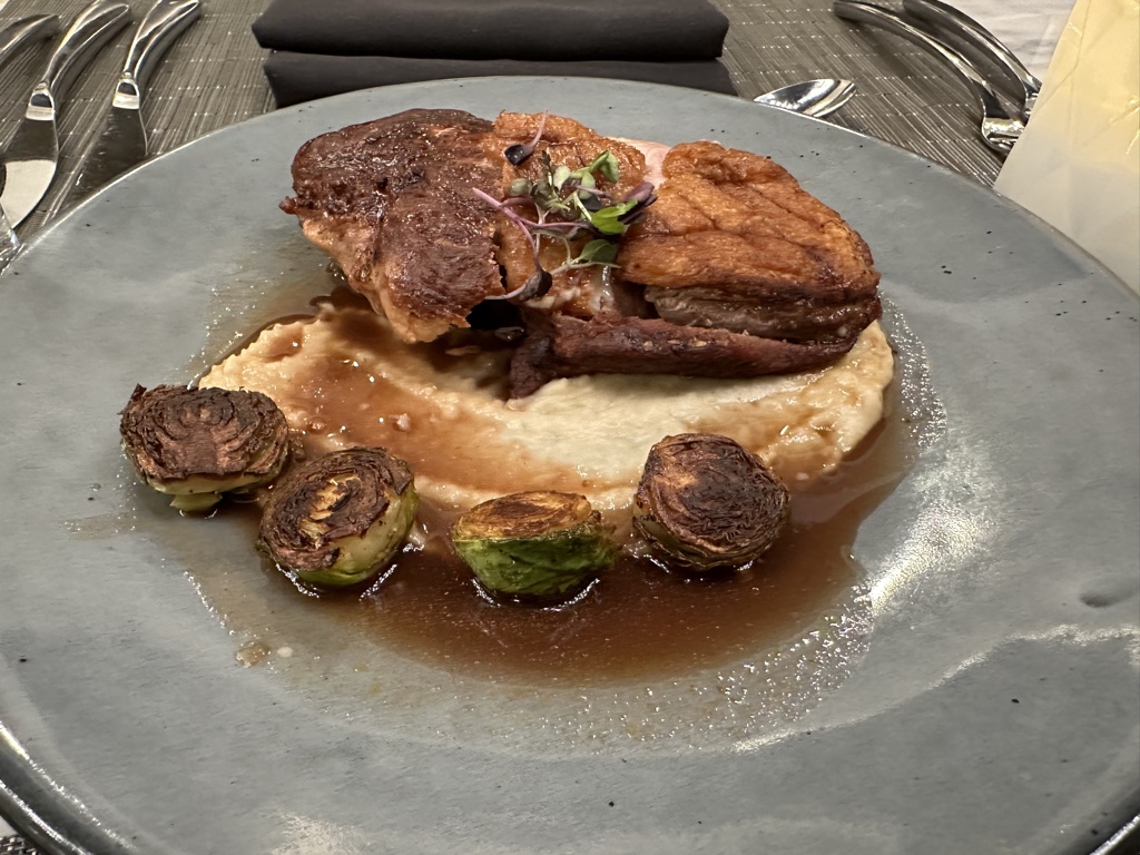 United Polaris lounge duck breast meal brussel sprouts