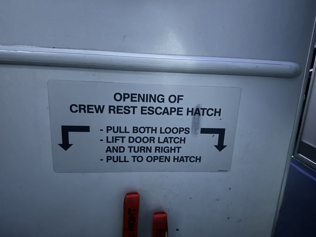 lufthansa business class munich miami a340 crew rest escape hatch sign