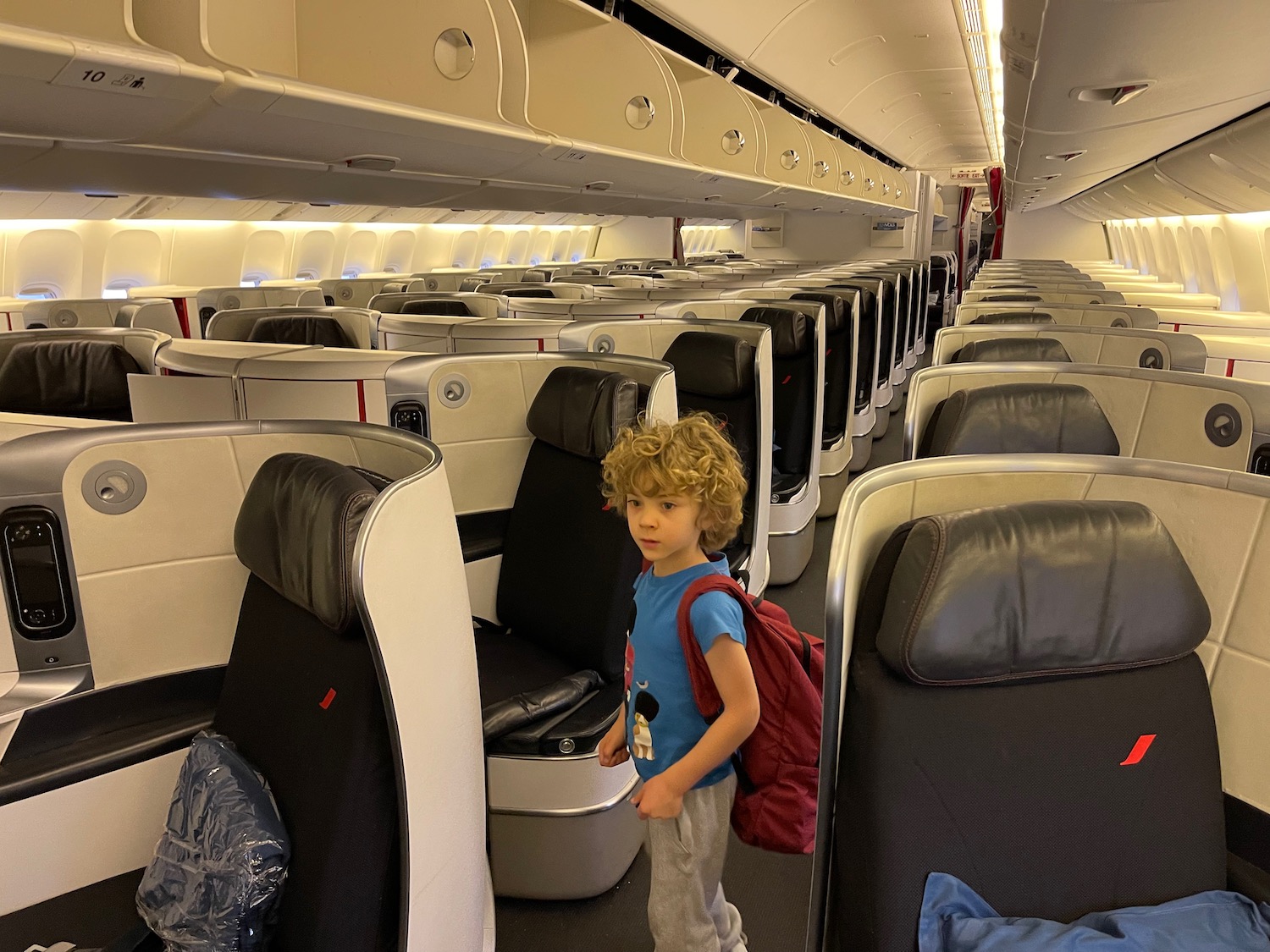 a child standing in an airplane