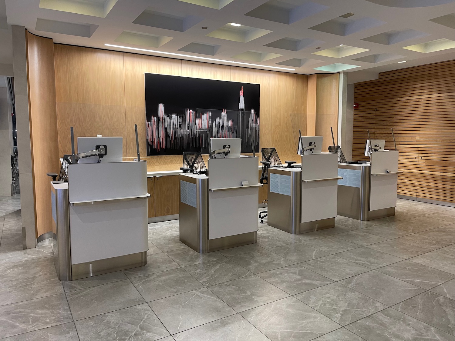 a group of white and black computers in a room