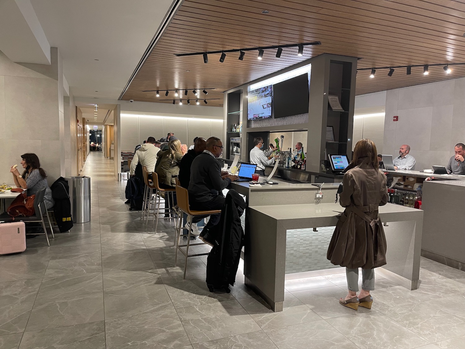 people sitting at a counter in a room