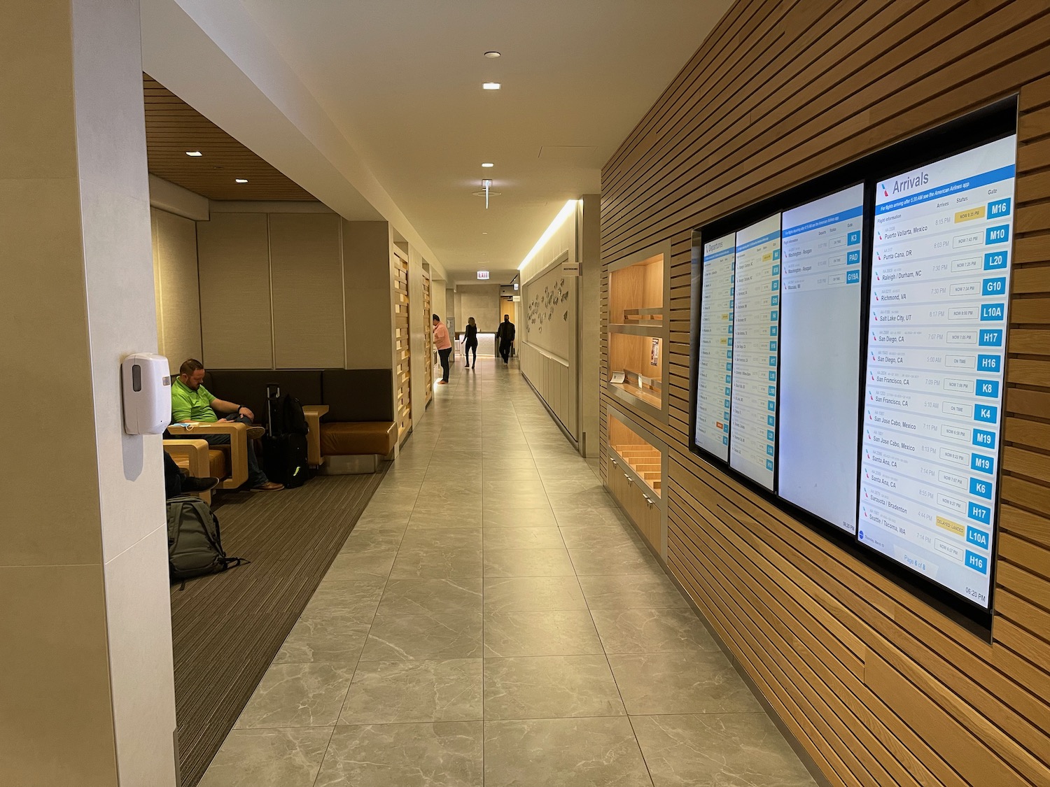 a long hallway with a large screen on the wall