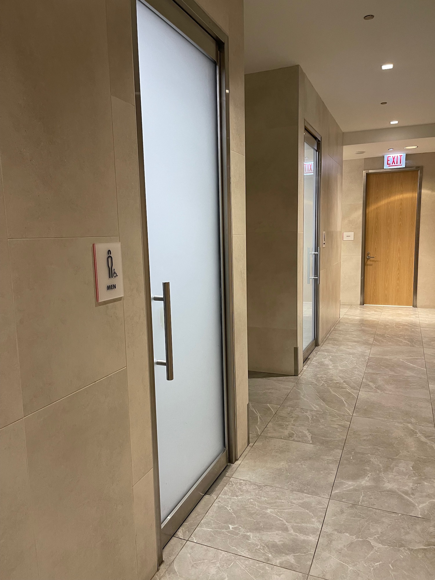 a hallway with a door and a sign