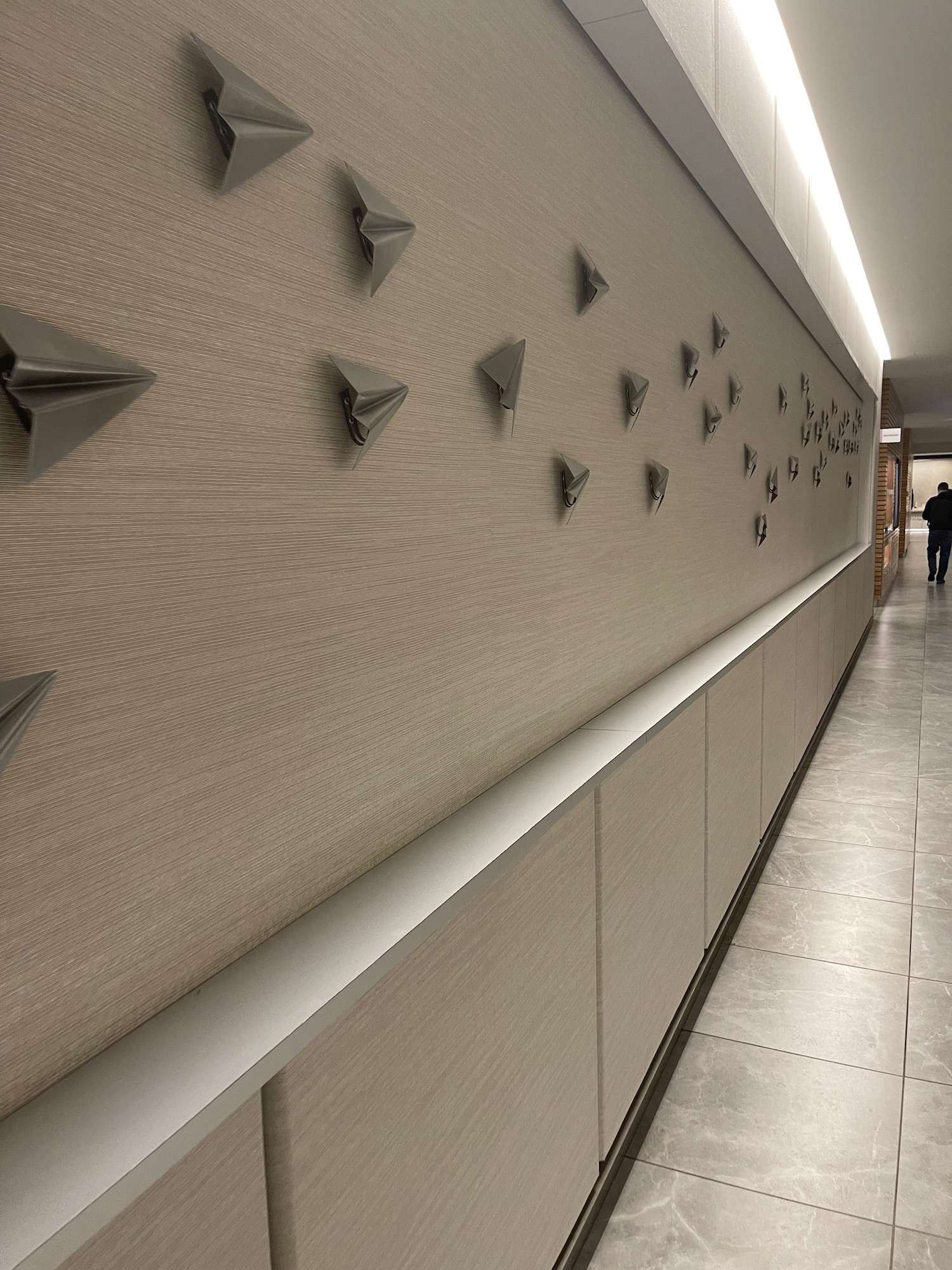 a wall with paper planes on it