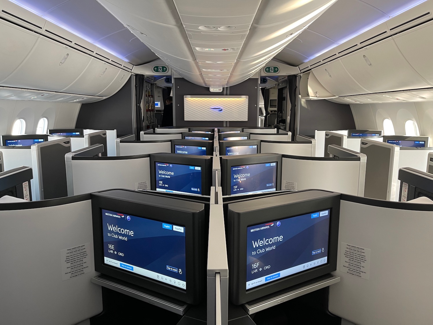 a row of monitors in an airplane