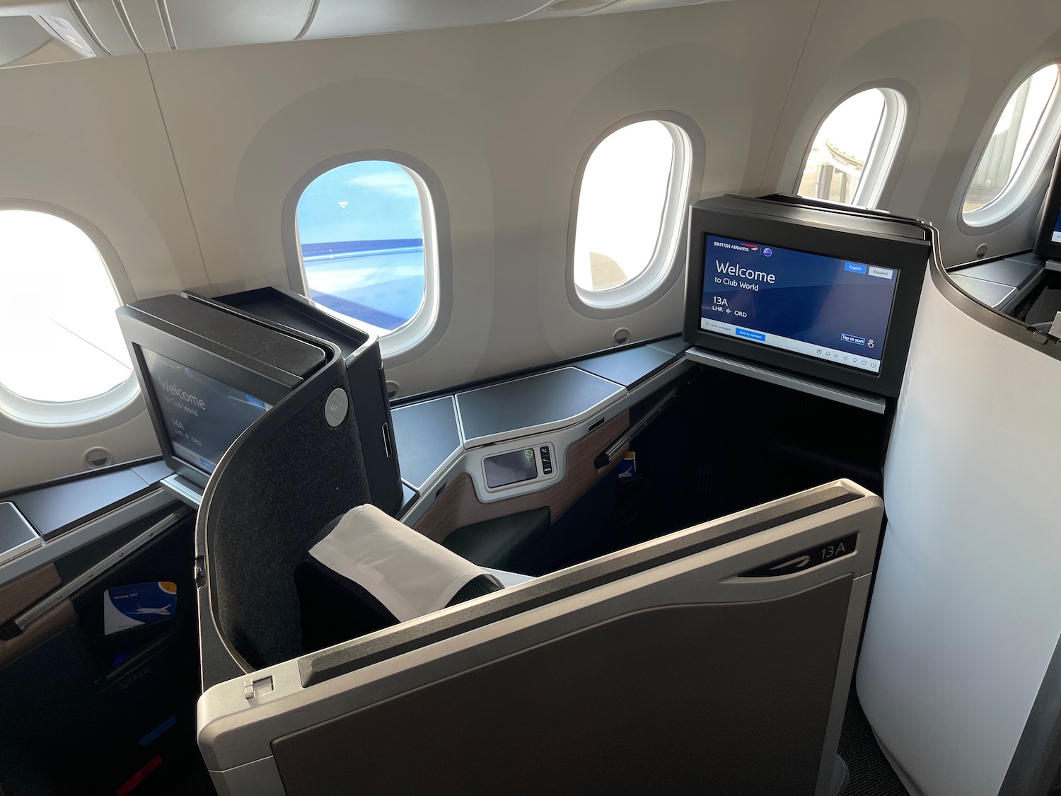 a seat in an airplane with windows