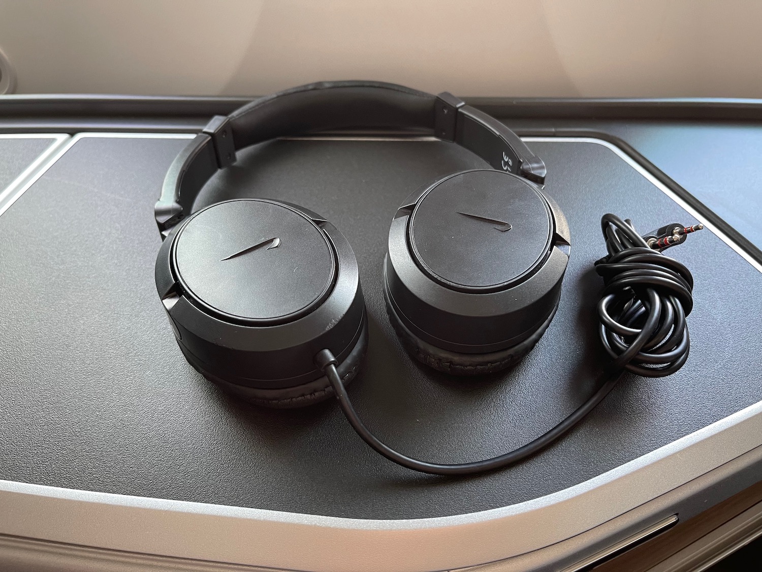 a pair of headphones on a black surface