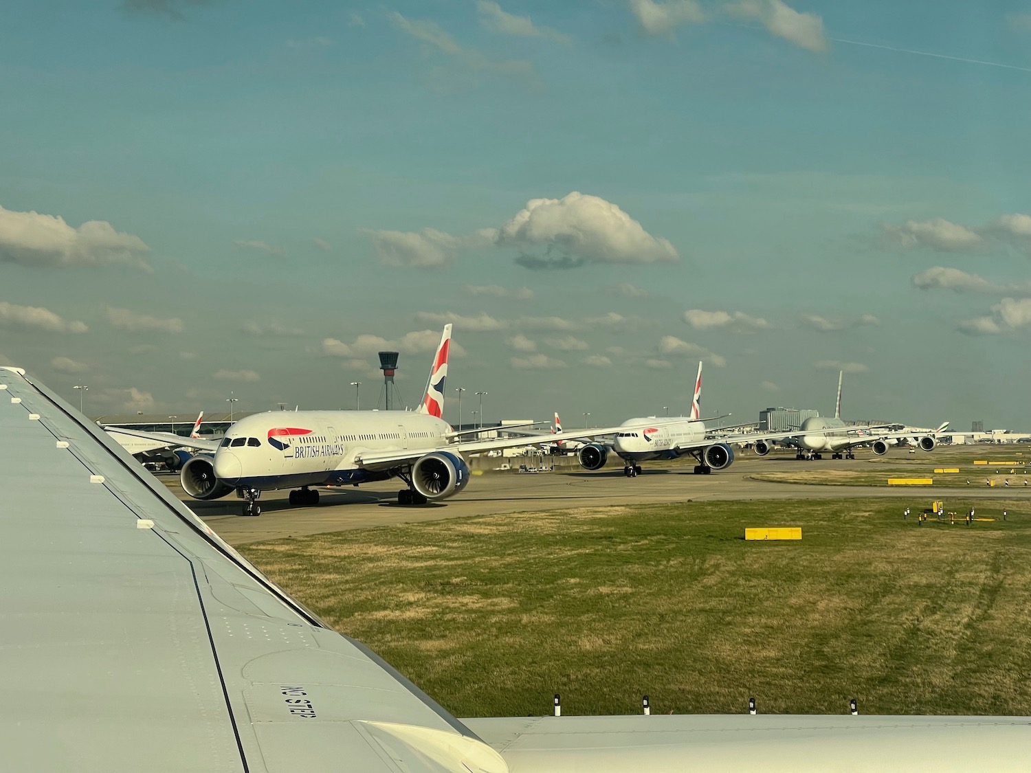 a group of airplanes on a runway