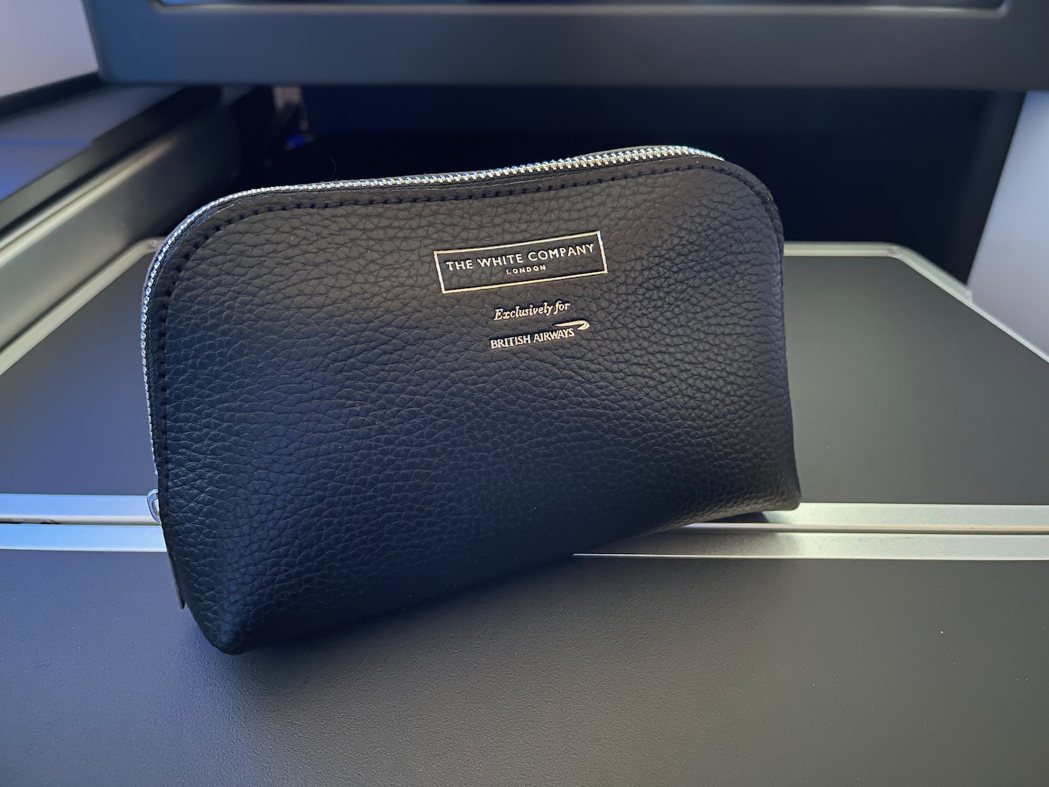 a black leather pouch on a black surface