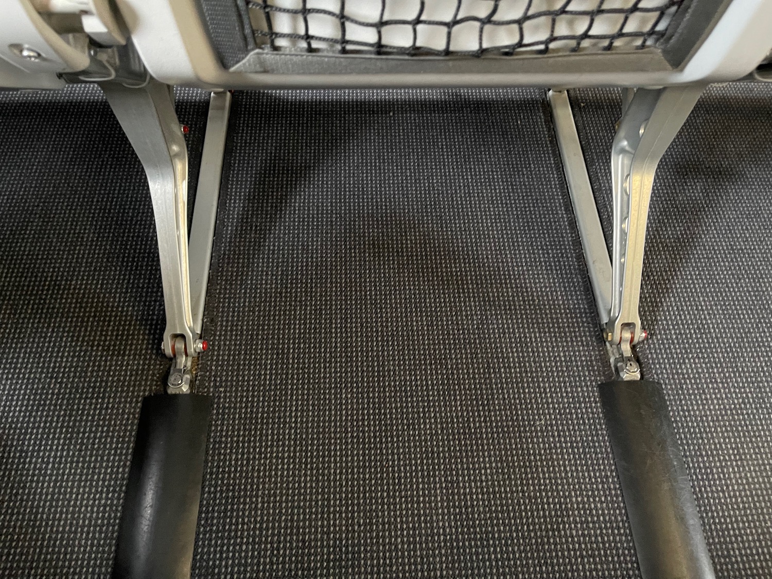 a metal and plastic foot rest