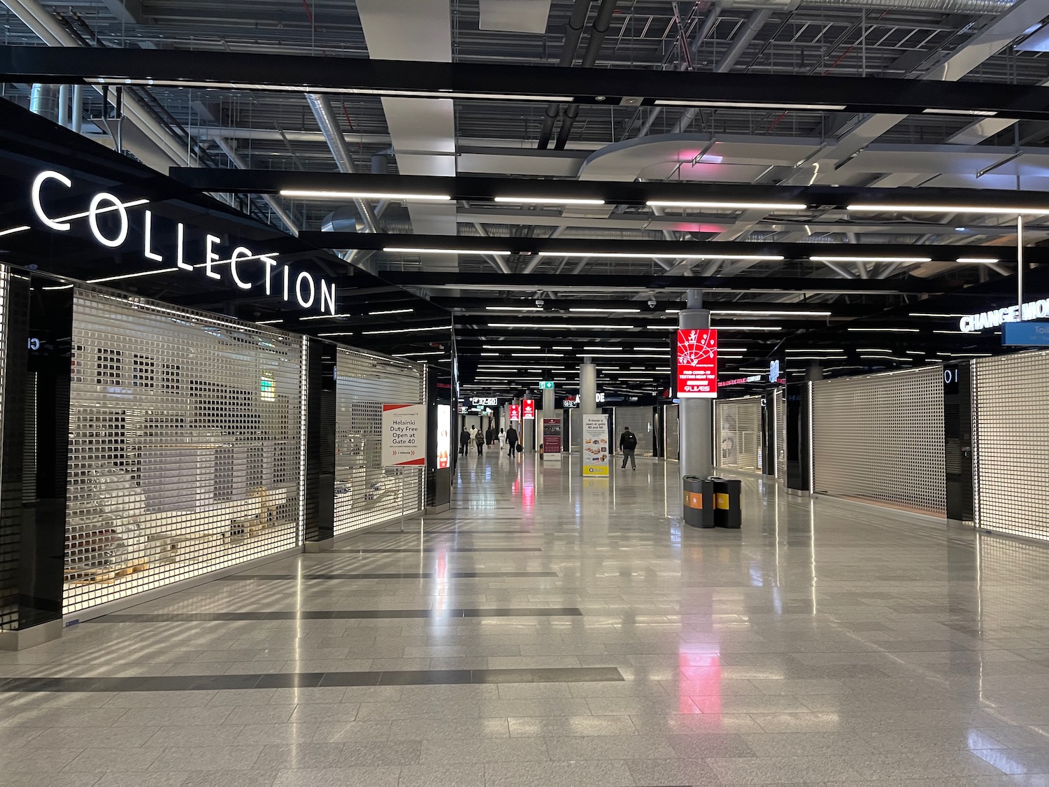 a large building with signs and a sign on the ceiling