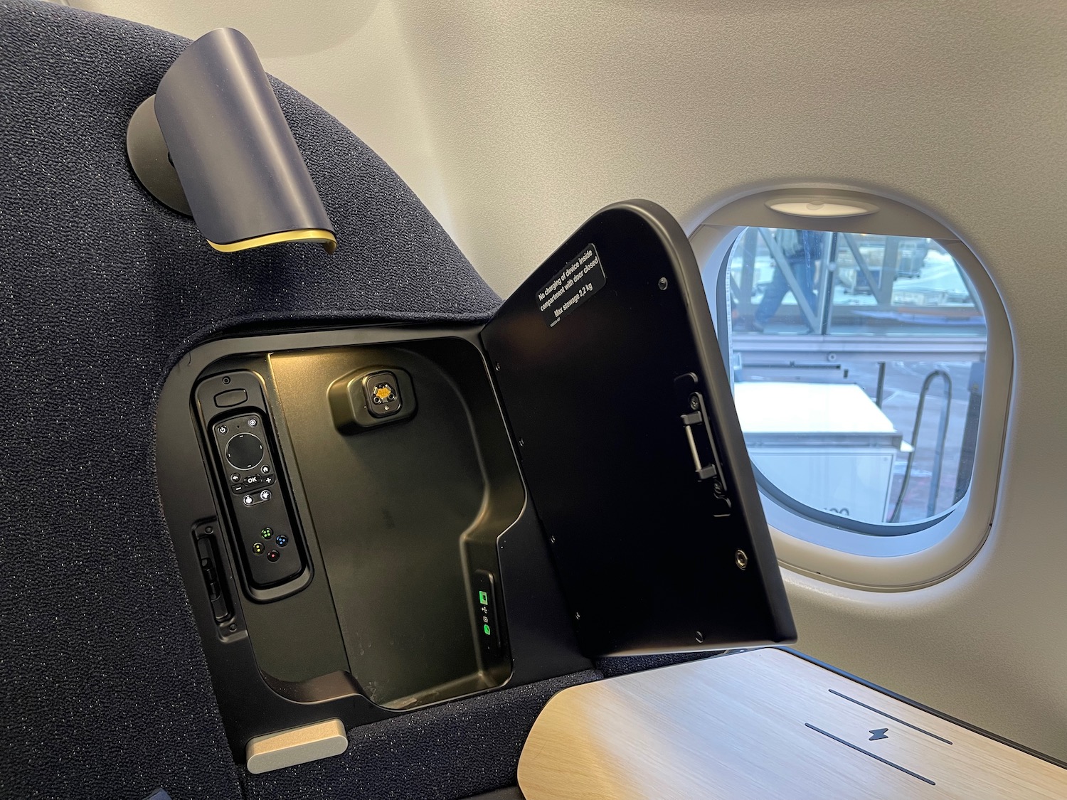 an airplane seat with a seat open