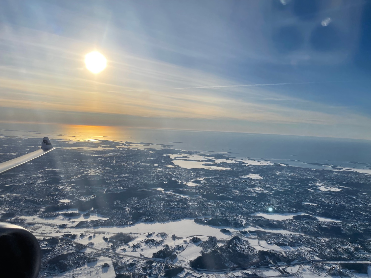 a sun shining over a city