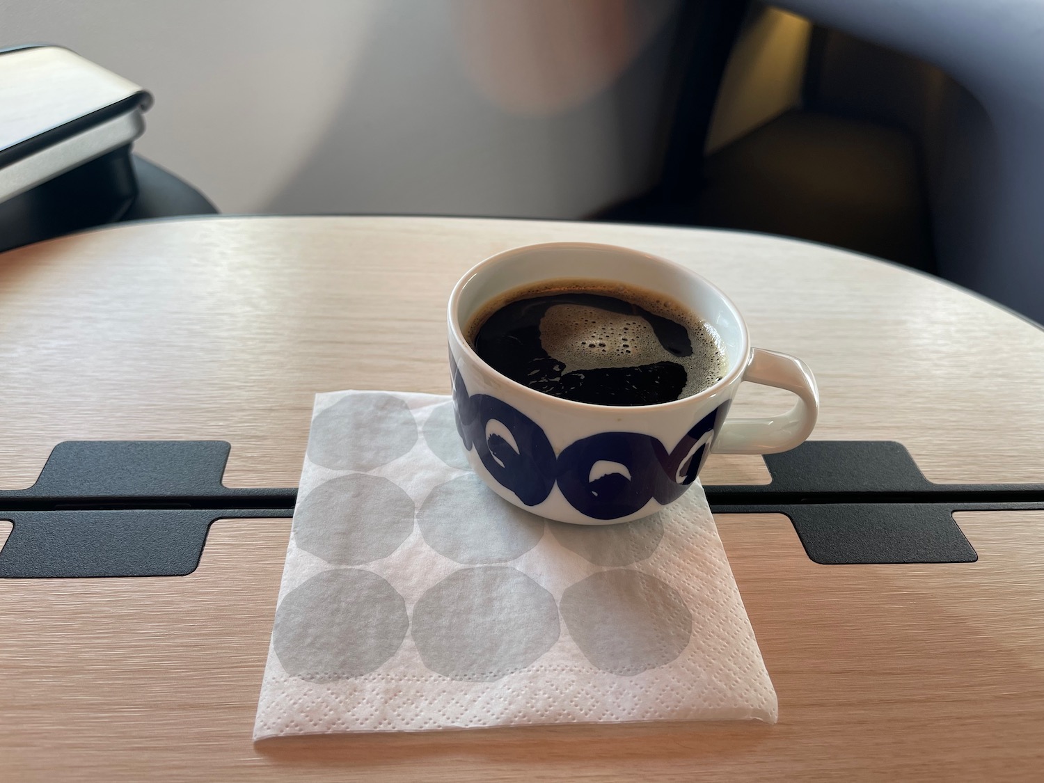 a cup of coffee on a napkin