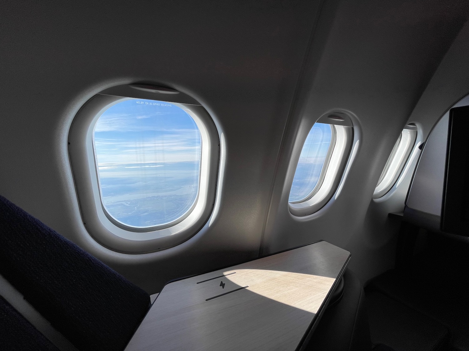 a table and windows in an airplane
