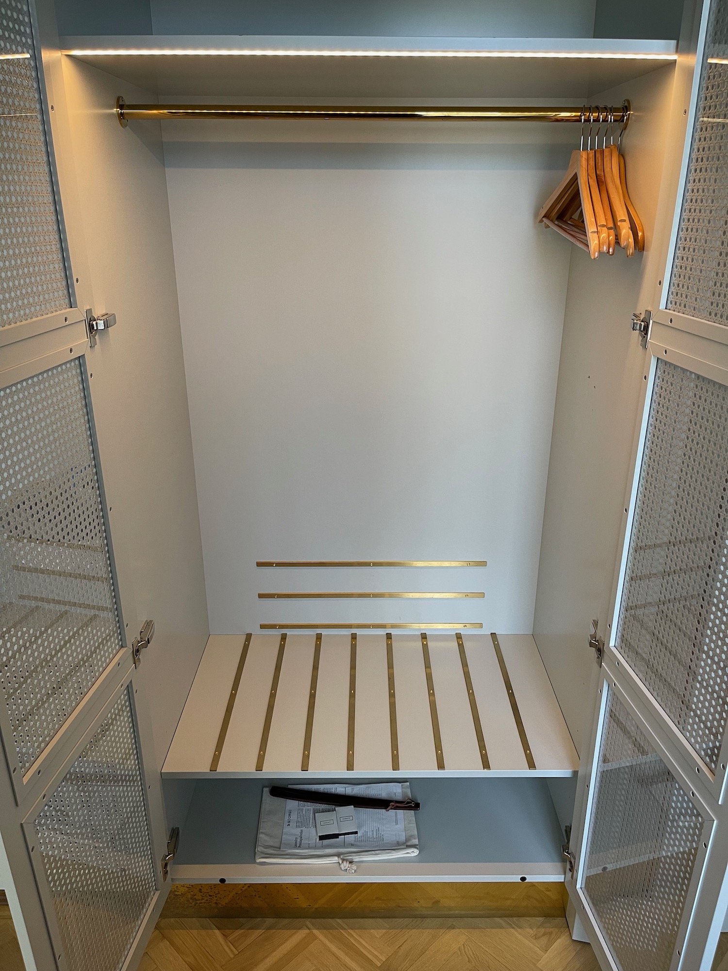 a closet with shelves and swingers