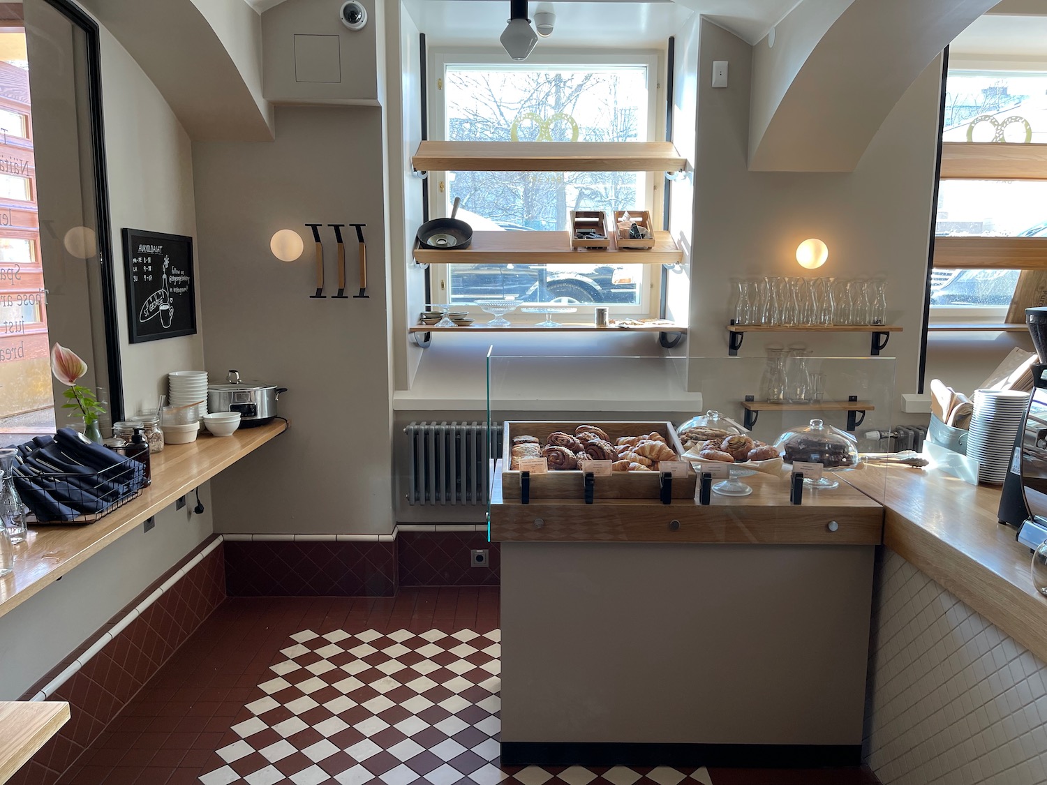 a kitchen with a counter and shelves