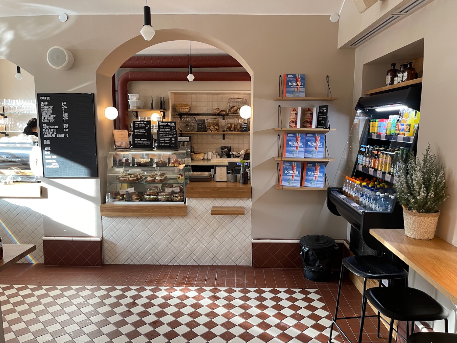 a coffee shop with a counter and drinks