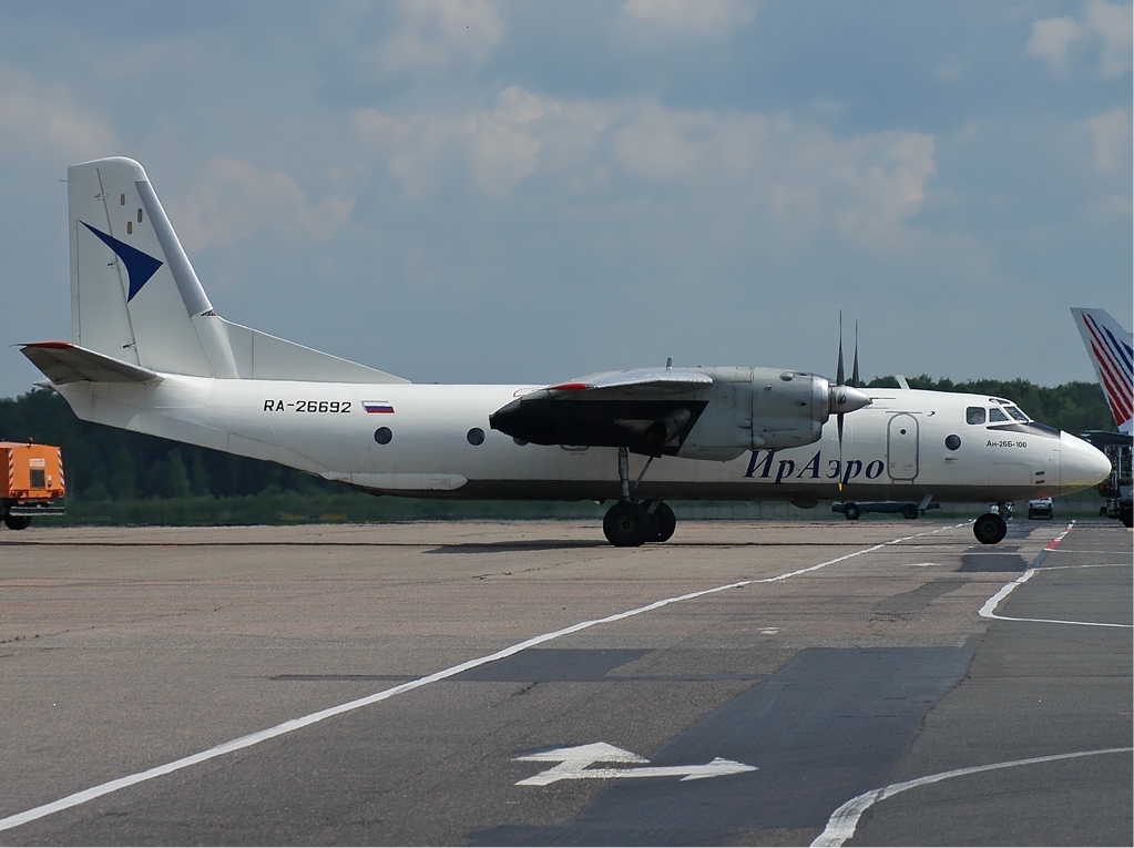 a white airplane on a runway