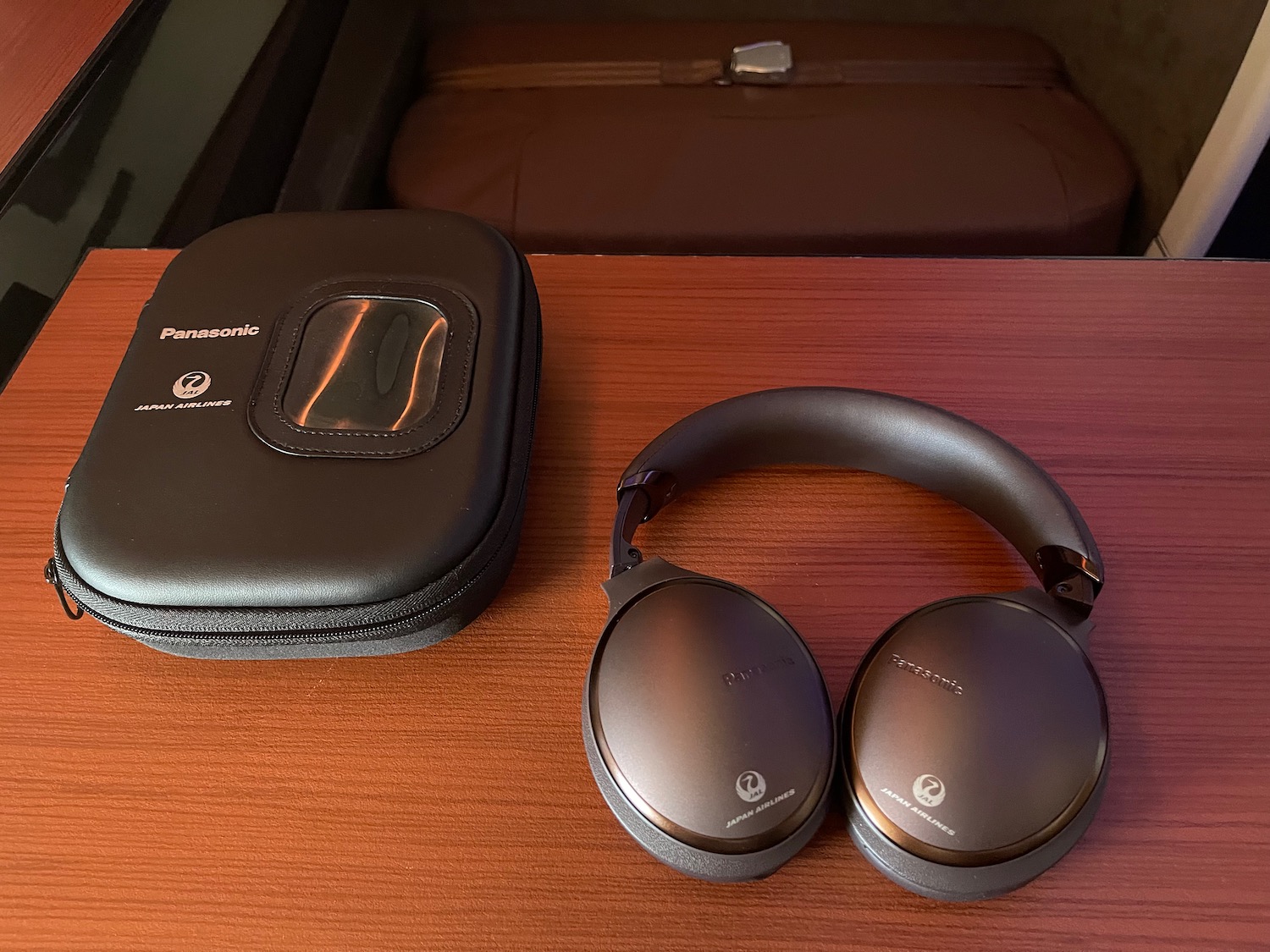 a pair of headphones next to a case