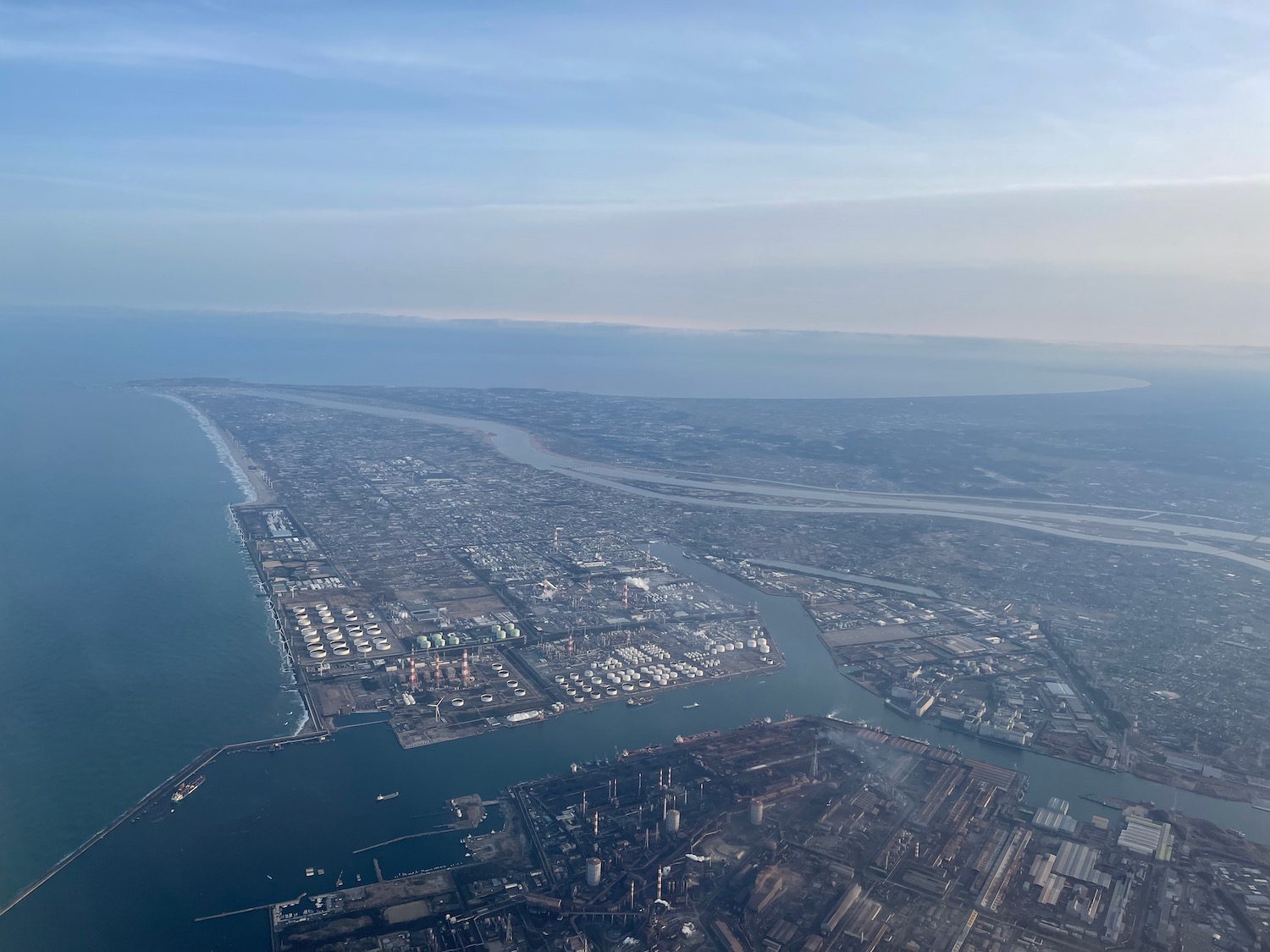 an aerial view of a city and water