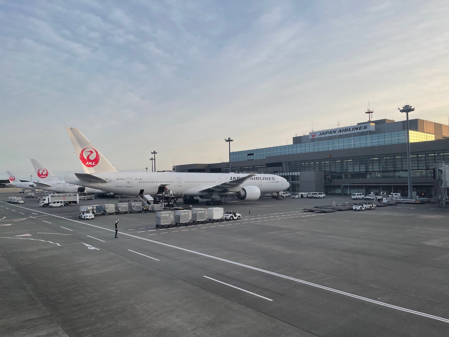 a large white airplane parked in a terminal