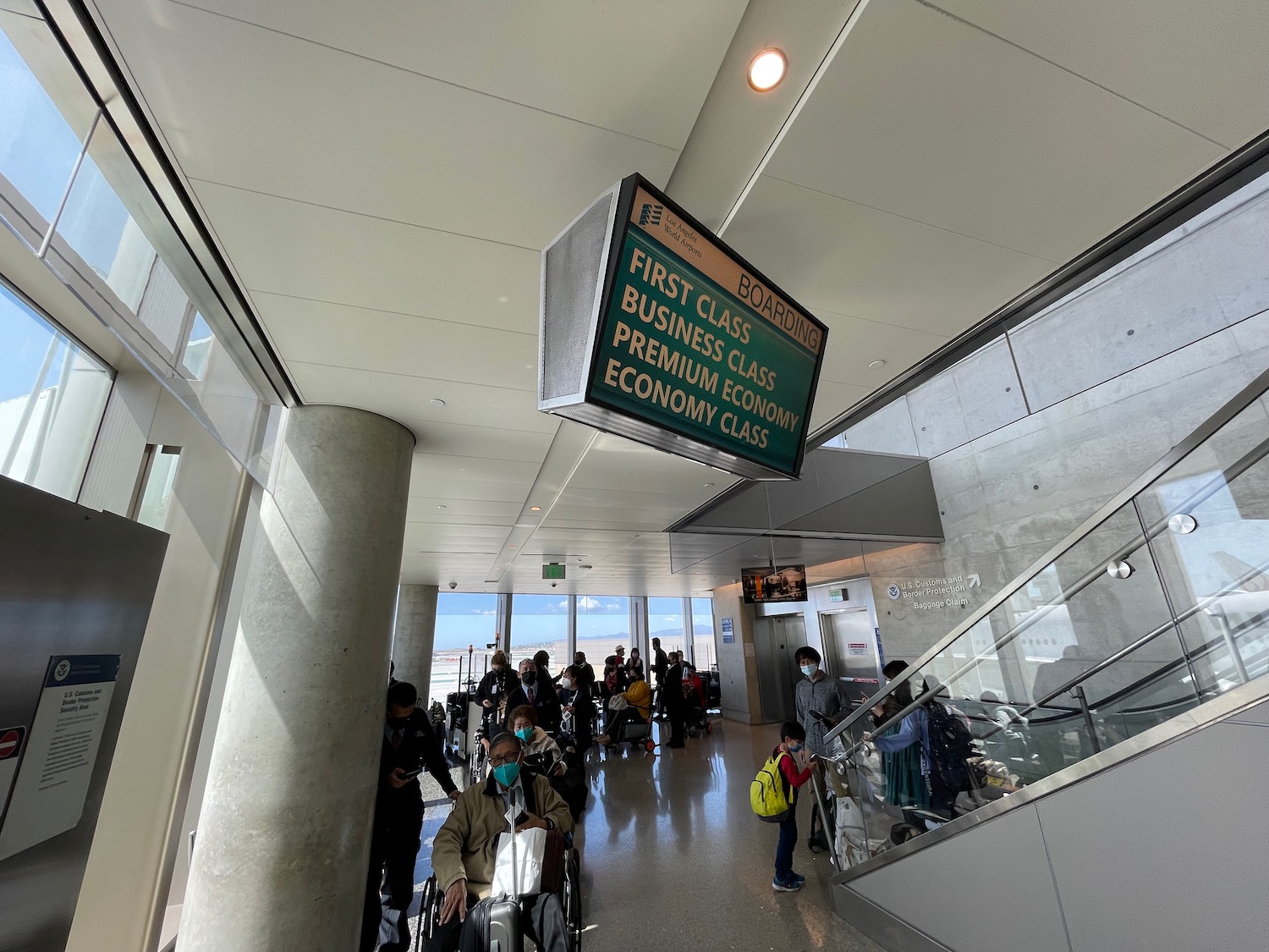 people in a building with a sign