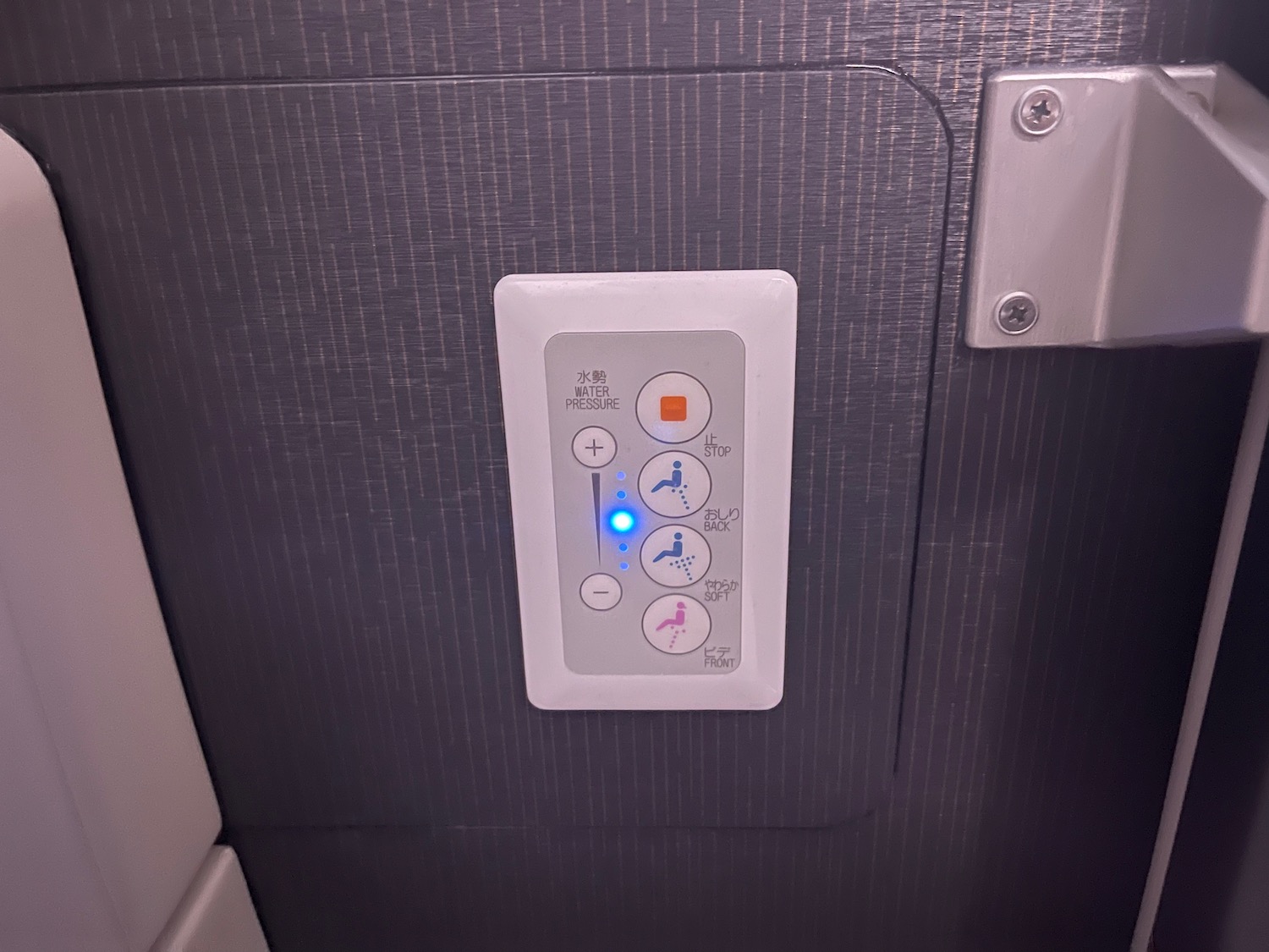 a white panel with buttons and lights on it