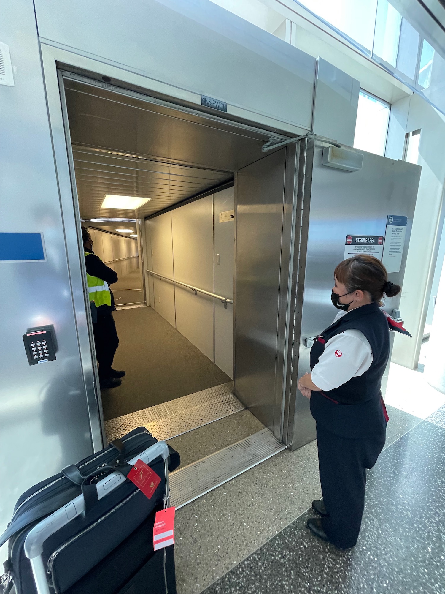 a woman standing in an elevator