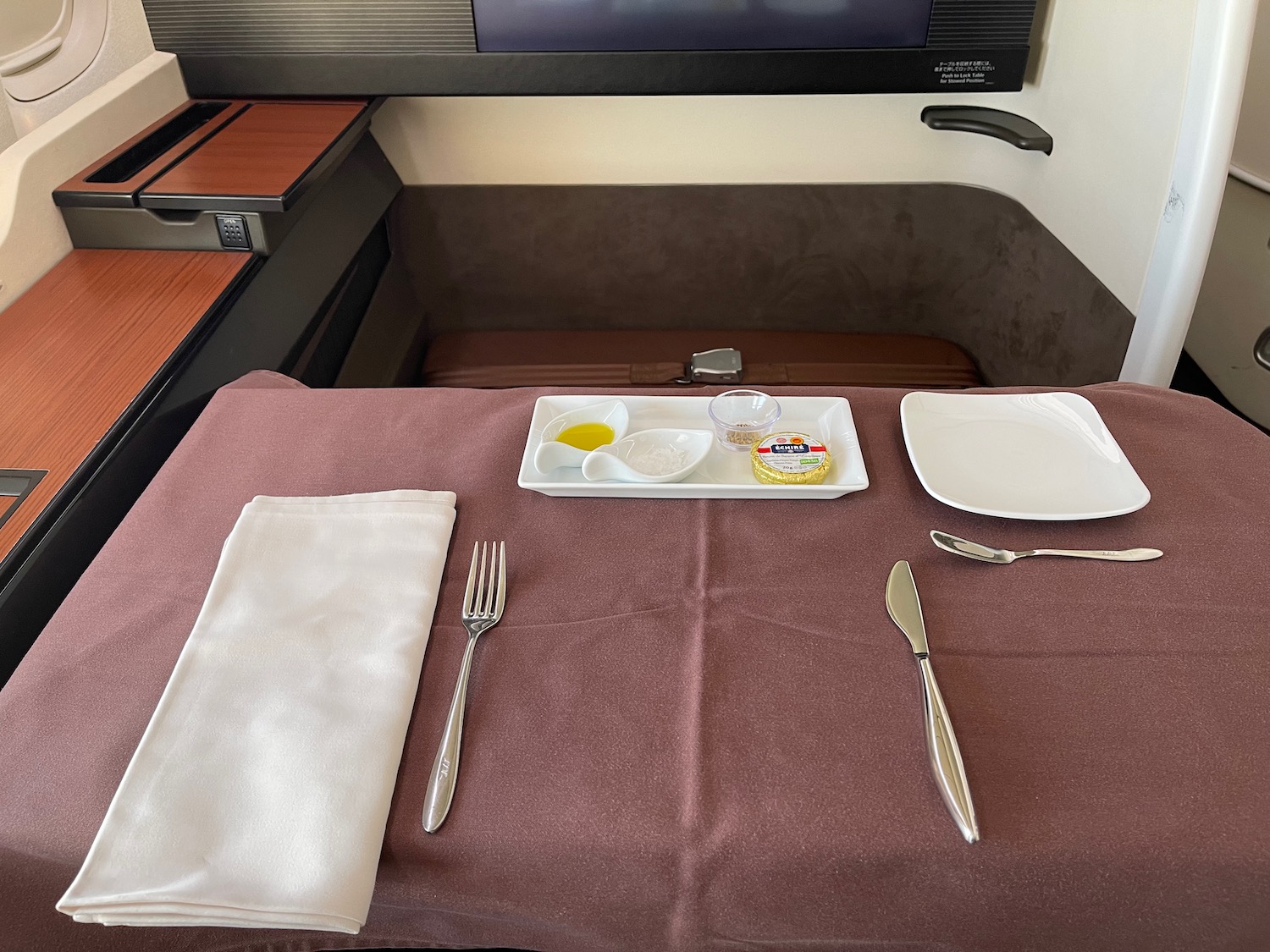 a table with a plate of food and a fork