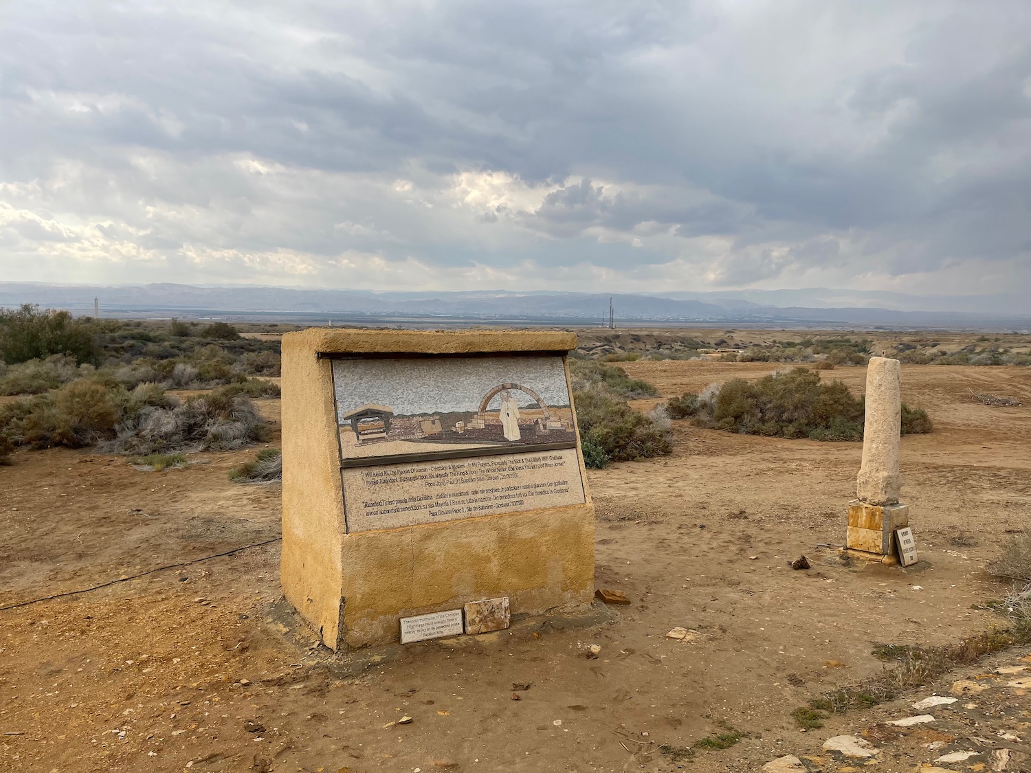 a stone sign in the desert