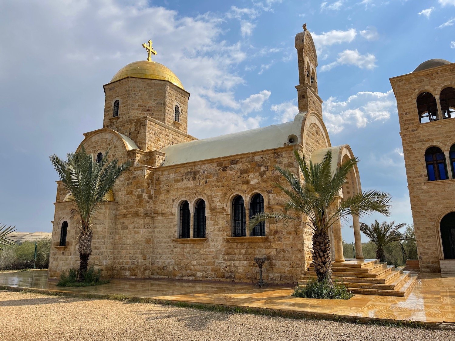 a stone building with a cross on top