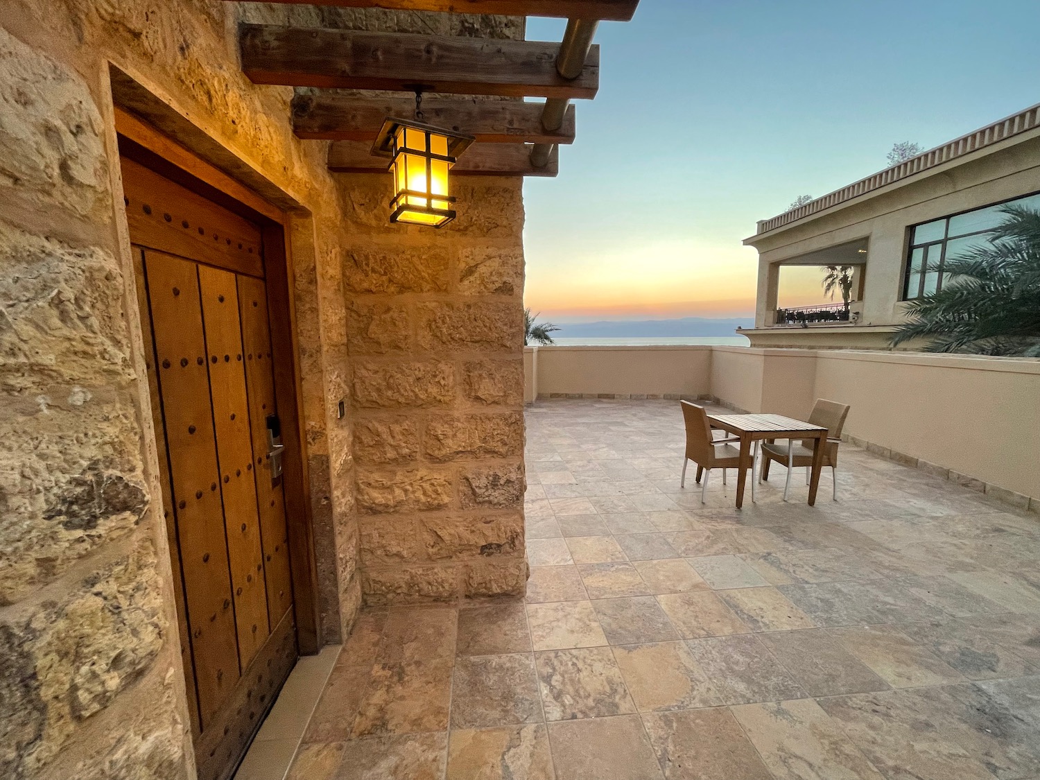 a patio with a table and chairs