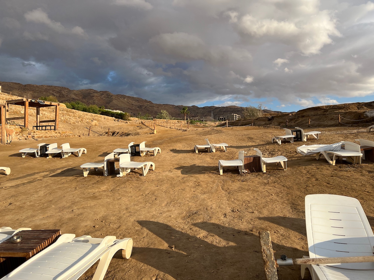 a group of chairs in a dirt area