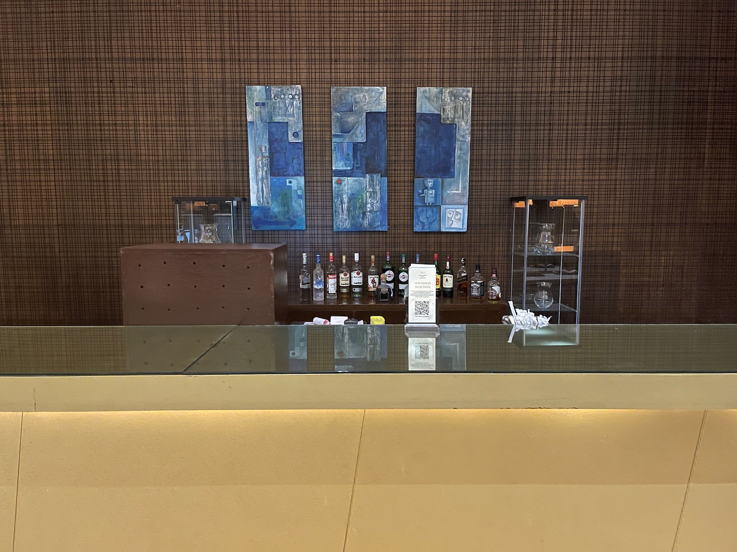 a bar with bottles of liquor on the counter