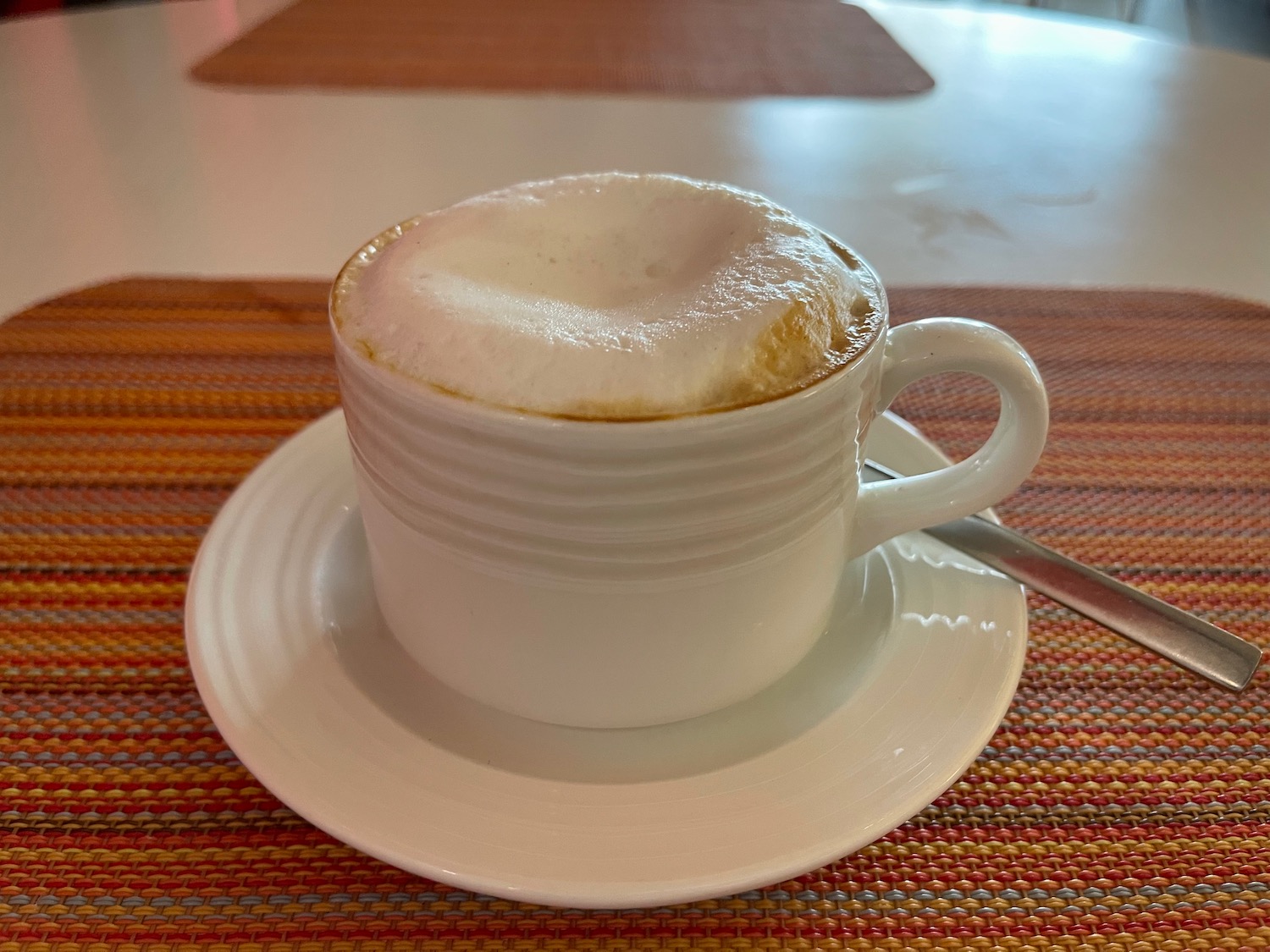 a cup of coffee on a plate