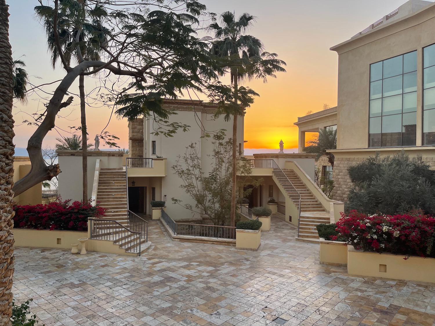 a building with stairs and trees