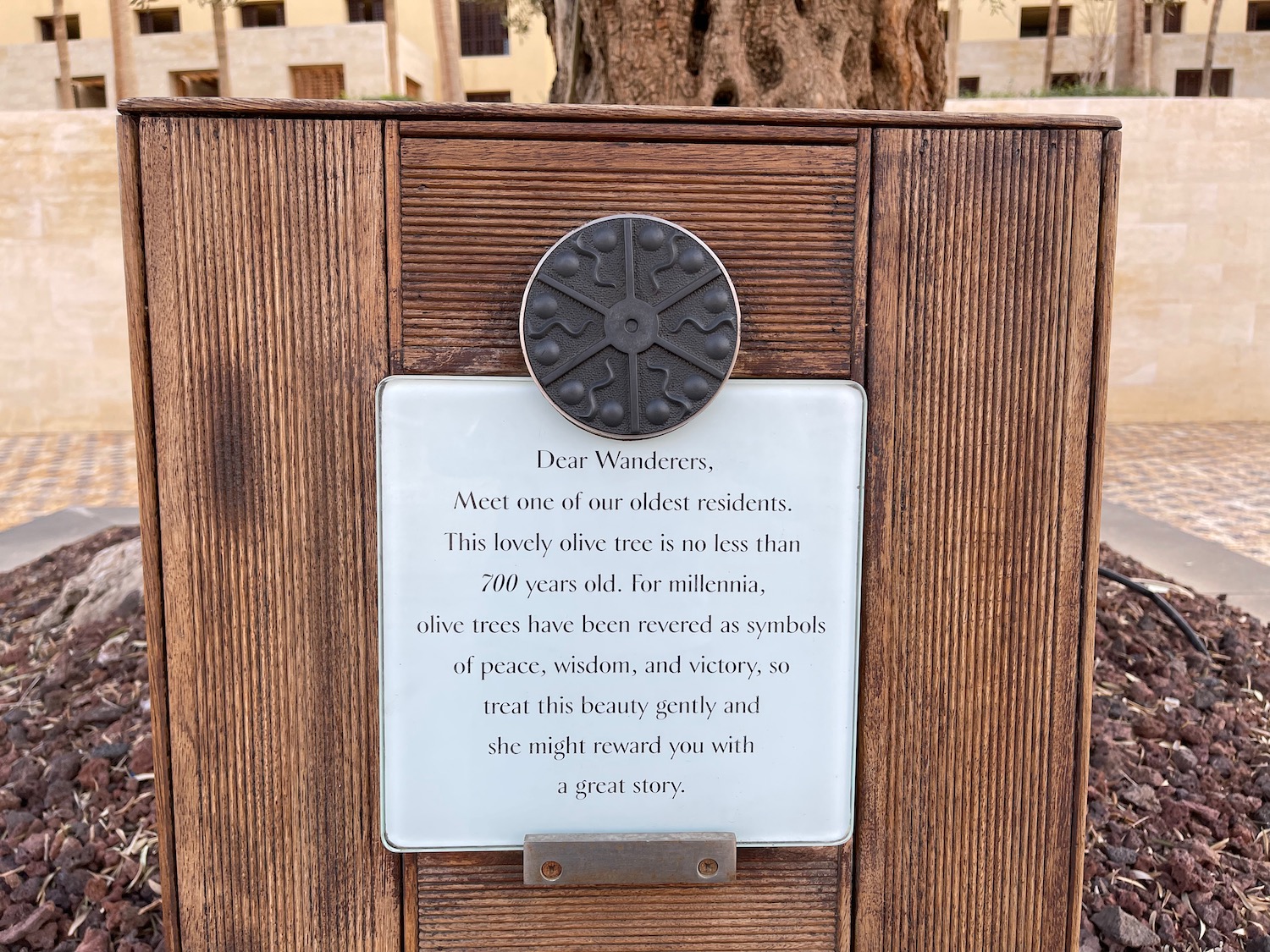 a sign on a wood surface