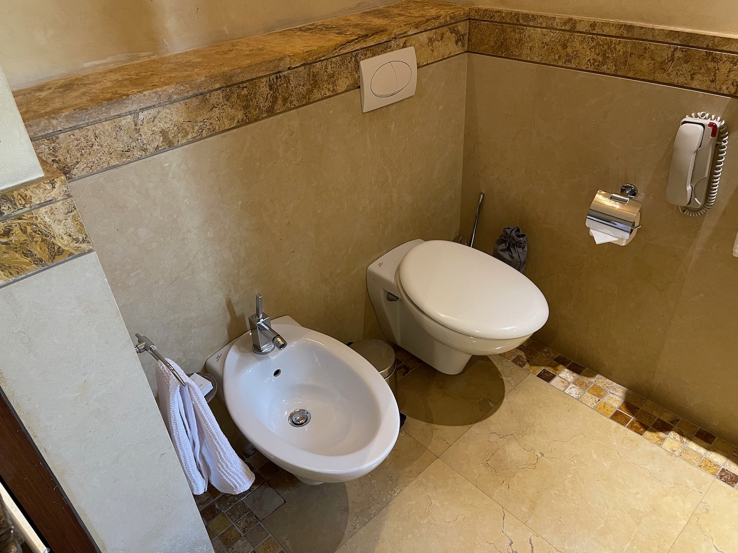 a toilet and bidet in a bathroom