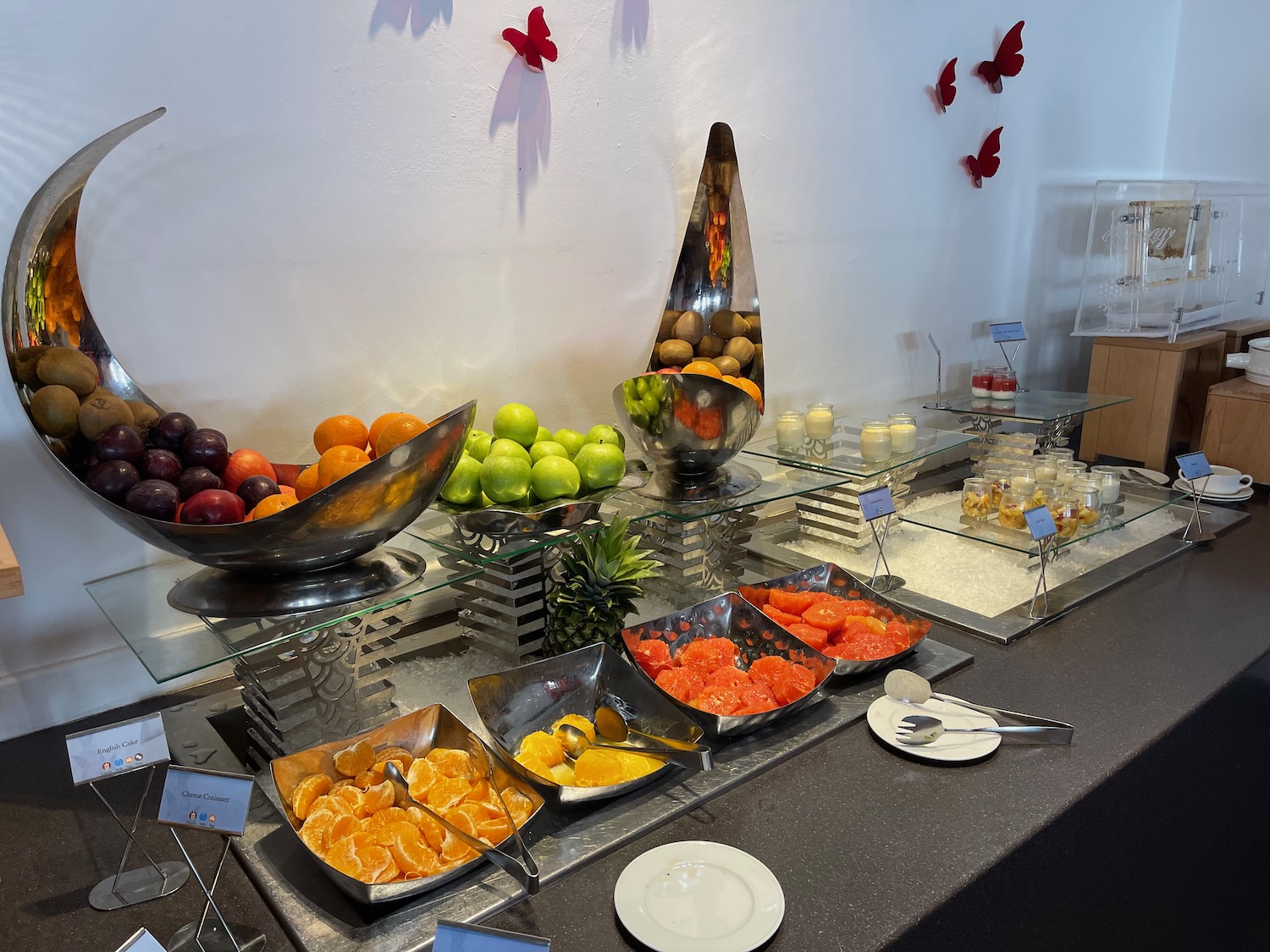 a buffet table with fruit and vegetables