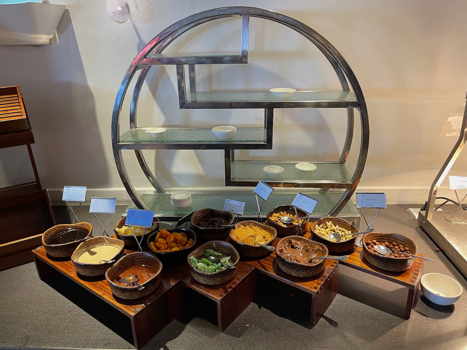 a group of bowls of food on a shelf