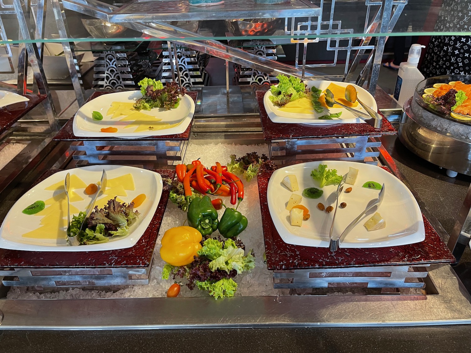 a buffet table with plates of food