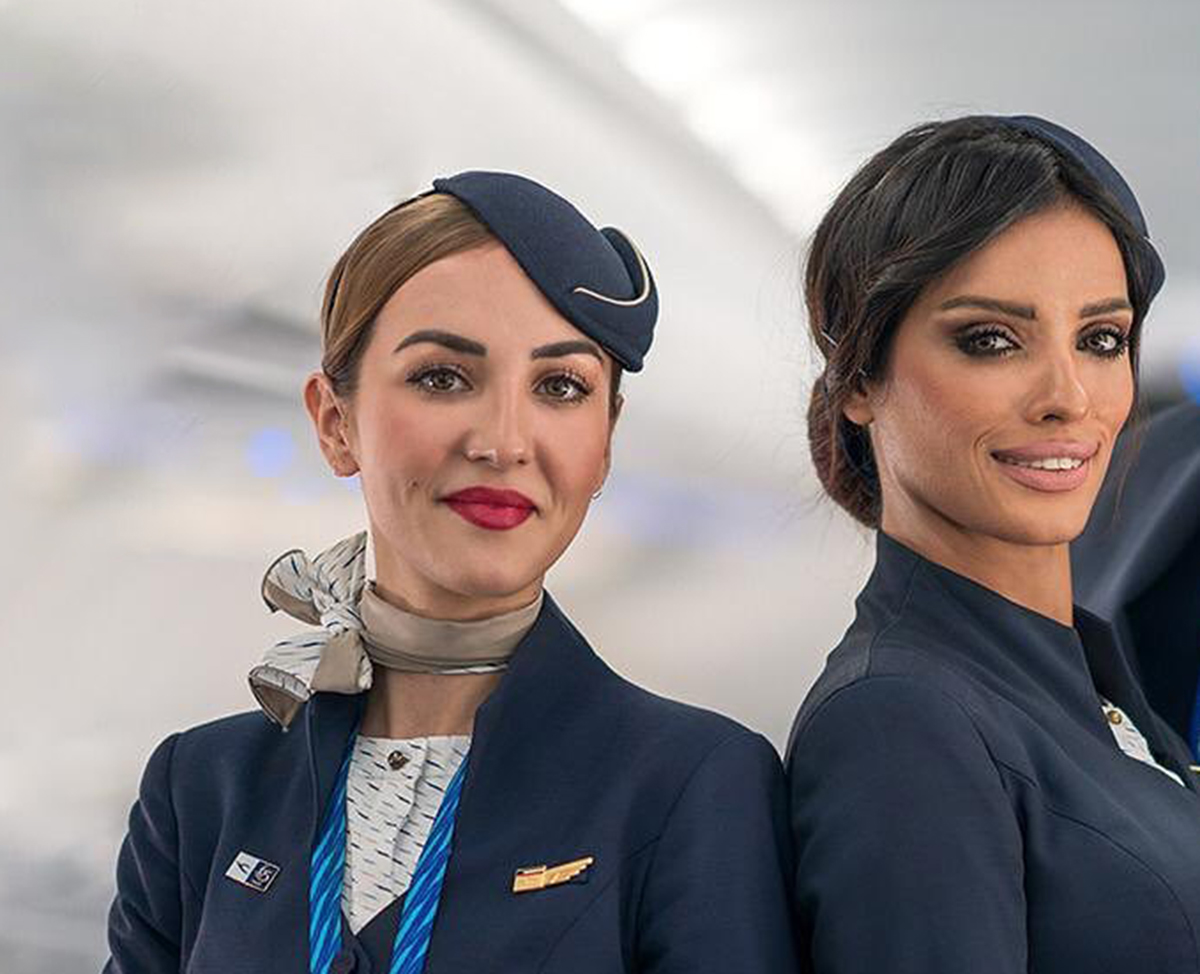 two women wearing uniforms