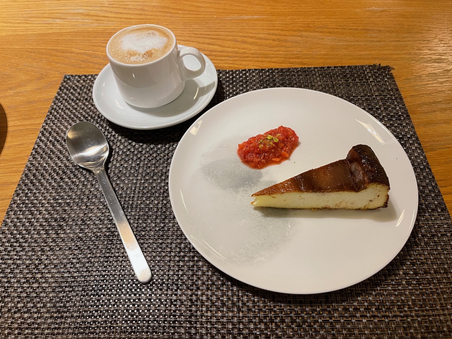 a plate with a slice of cake and a cup of coffee