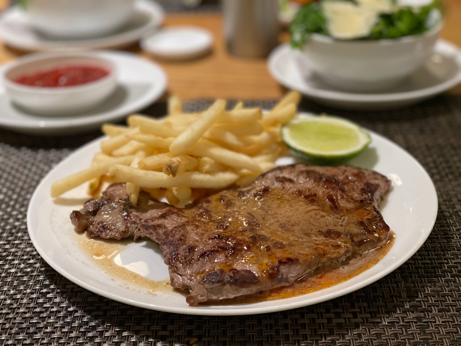 a plate of steak and fries