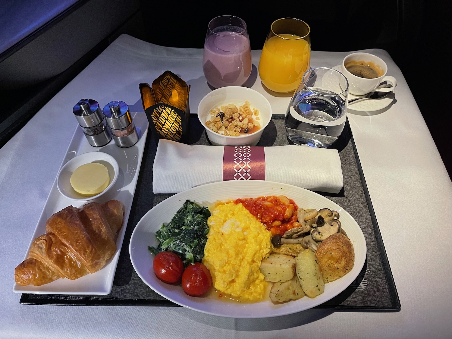 a plate of food and drinks on a tray