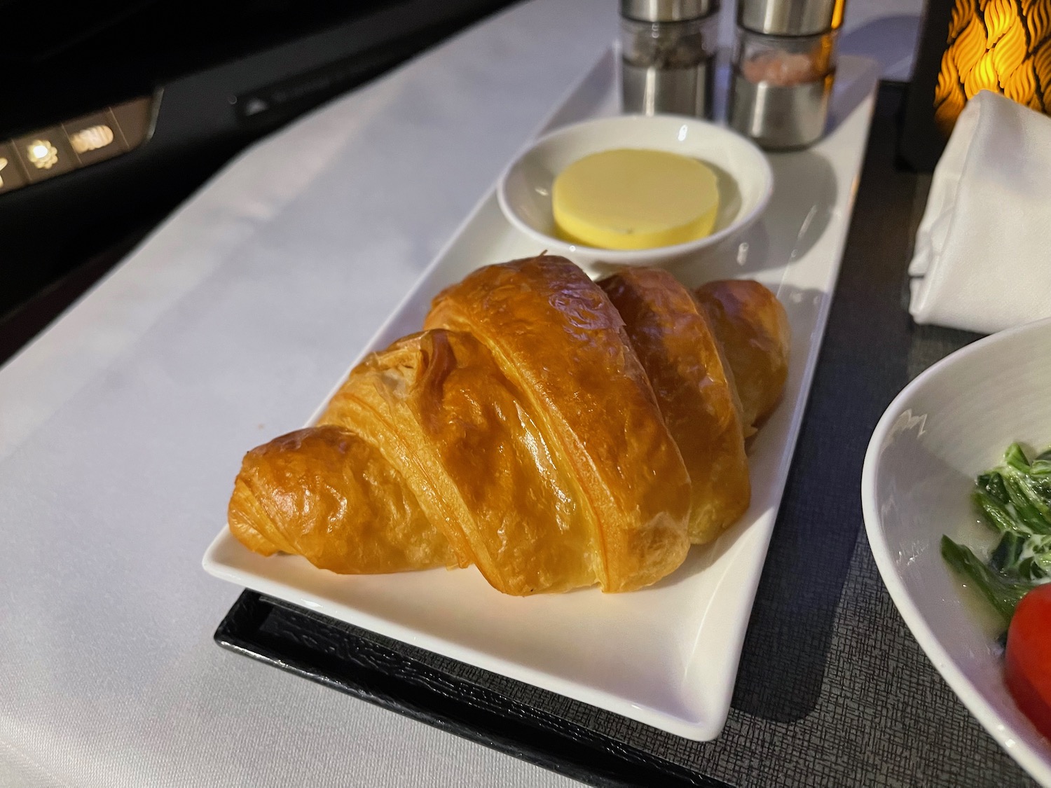 a plate of croissant and butter